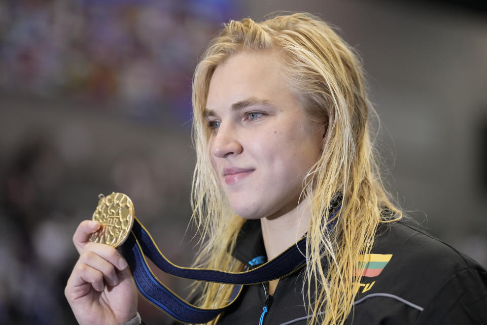 Gold medalist Ruta Meilutyte of Lithuania pose during ceremonies of the women's 100m breaststroke finals at the World Swimming Championships in Fukuoka, Japan, Tuesday, July 25, 2023. (AP Photo/Lee Jin-man)