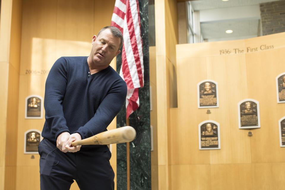 Jim Thome demonstrates his swing in the Plaque Gallery during his orientation tour of the National Baseball Hall of Fame and Museum, Tuesday, Feb. 27, 2018, in Cooperstown, N.Y.