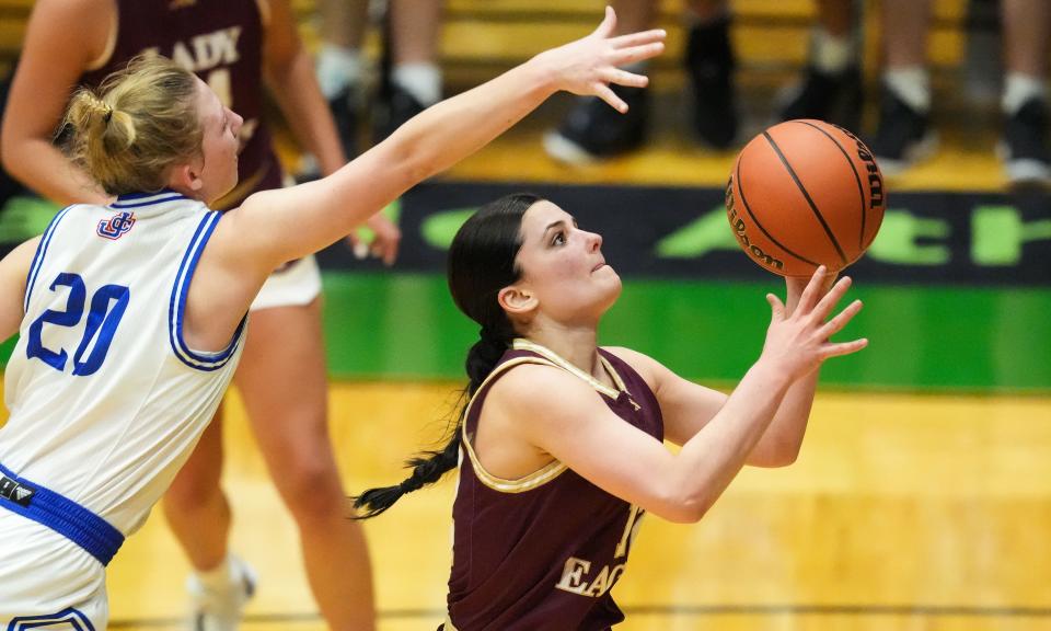 Columbia City Eagles guard Kyndra Sheets (12) attempts to score against Jennings County Panthers Alivia Elmore (20) on Thursday, Oct. 5, 2023, during the Hall of Fame Classic girls basketball tournament at New Castle Fieldhouse in New Castle. The Columbia City Eagles defeated the Jennings County Panthers, 56-47.