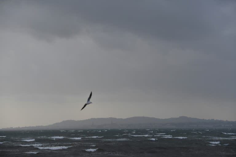 Dark clouds gathered over the Irish Sea and Dublin as Ireland braced for the passing of the storm Ophelia that left three dead and hundreds of thousands of homes without power