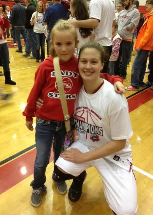 2024 IndyStar Miss Basketball Chloe Spreen poses for a photo with Jenna Allen, Bedford North Lawrence coach Jeff Allen's oldest daughter, after the Stars' 2013 regional championship.