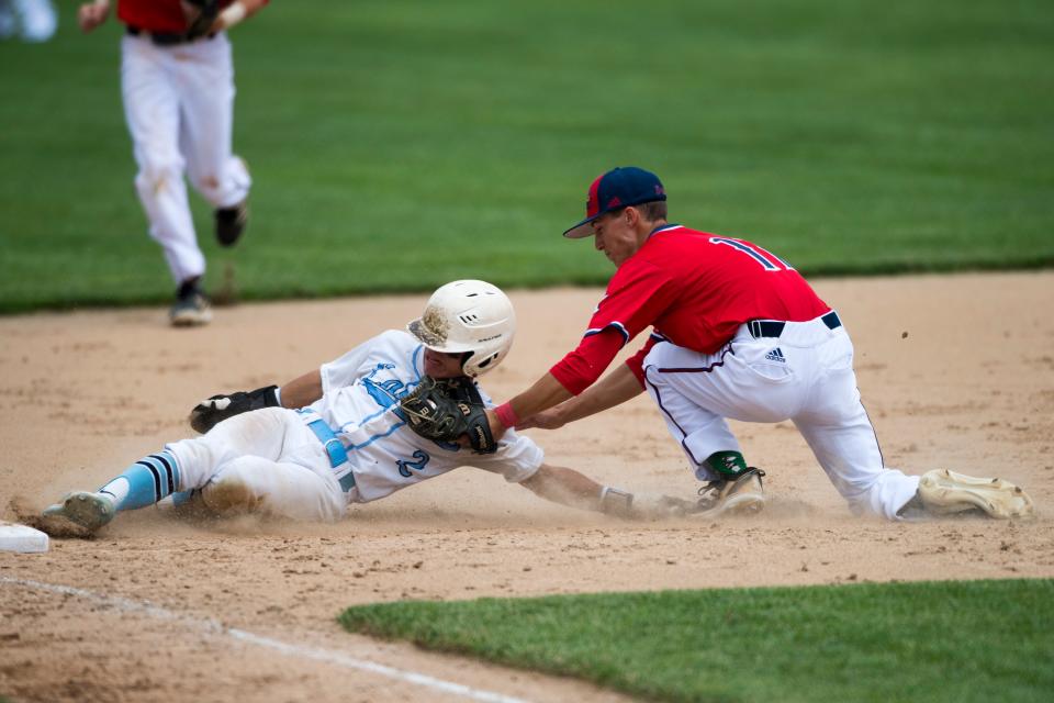 Tecumseh’s DJ Dupont (11) tags out Shakamak’s Riley Huckaby (2) at third as the Tecumseh Braves play the Shakamak Lakers in the 2022 Class A semi-state game at Alvin C. Ruxer Field in Jasper, Ind., Saturday, June 11, 2022. 