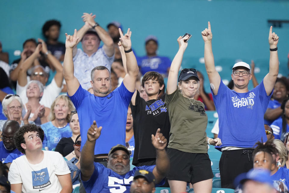 Middle Tennessee fans cheer during the second half of an NCAA college football game against Miami, Saturday, Sept. 24, 2022, in Miami Gardens, Fla. (AP Photo/Wilfredo Lee)