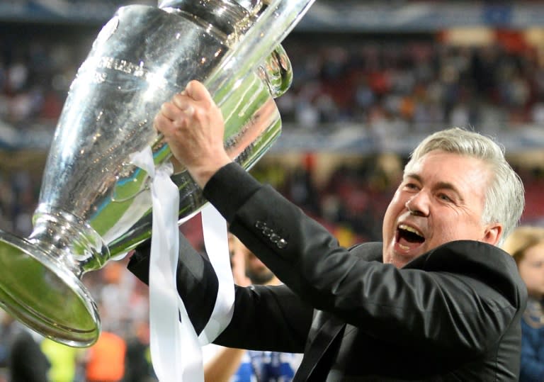 Carlo Ancelotti celebrates with the Champions League trophy after guiding Real Madrid to a 4-1 victory over Atletico Madrid in 2014