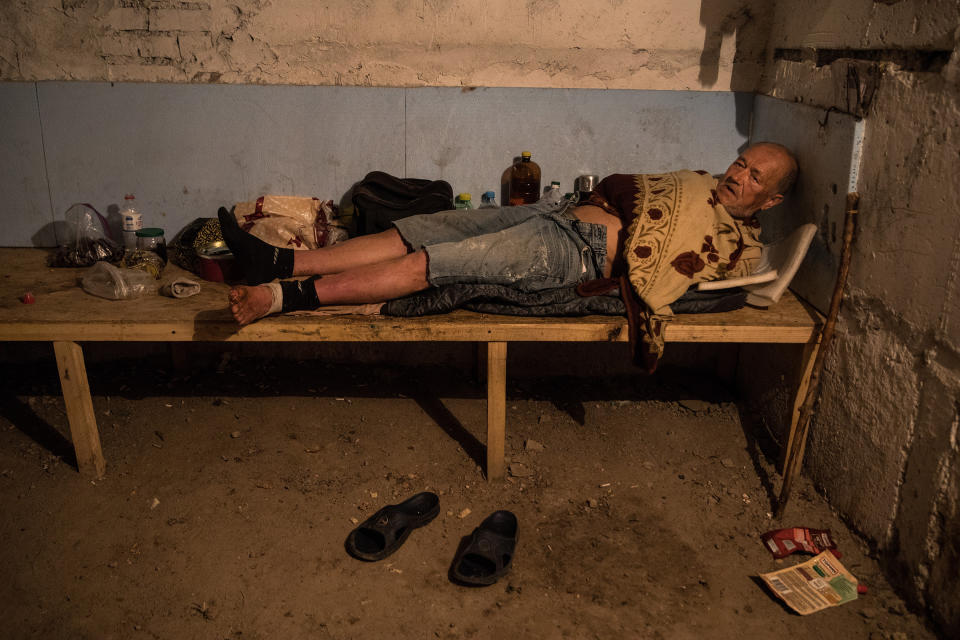 <span class="s1">Nikolay, age 61, is homeless — his house was destroyed in old Avdiivka. He sleeps in an underground bunker in one of the apartment blocks in the city. He barely survives, has lost his passport and has no money for medicine. He is unable to receive a pension since his documents were destroyed. He collects garbage for recycling to earn a little money. Over the winter he got frostbite in his feet, causing an infection that won’t go away; he is in constant pain. (Photograph by Paula Bronstein)</span>