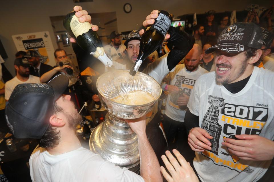 <p>Pittsburgh Penguins center Nick Bonino pours champagne into the Stanley Cup after defeating the Nashville Predators in Game 6 of the 2017 Stanley Cup Final at Bridgestone Arena. Credit: Dave Sandford/NHLI/Pool Photo via USA TODAY Sports </p>