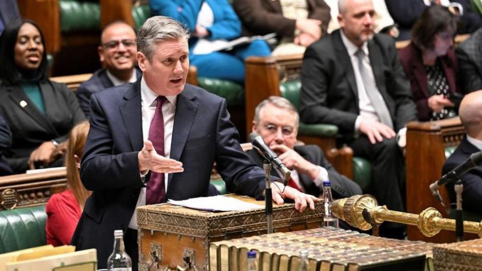 Sir Keir Starmer, dressed in a dark suit, stands at the despatch box in the House of Commons in February 2024