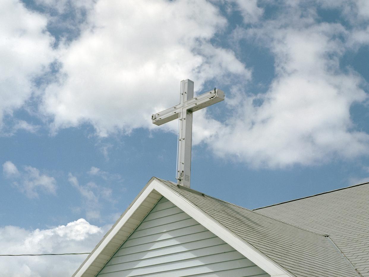 Cross on Top of a Church - stock photo