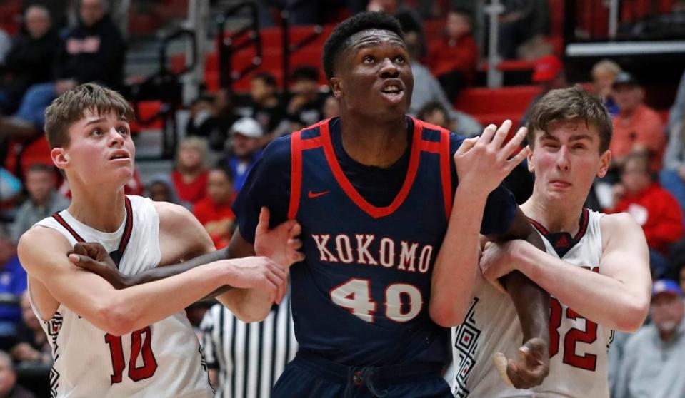 Lafayette Jeff Bronchos’ Ethan Smith (10) and Parker Rosi (32) attempt to box out Kokomo Wildkats center Flory Bidunga (40) during the IHSAA boy’s basketball game, Friday, Jan. 27, 2023, at Lafayette Jeff High School in Lafayette, Ind.