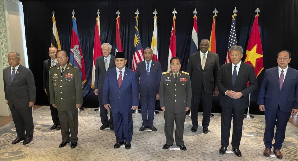 In this photo released by MINDEF on Friday, June 2, 2023, from left to right front role, Brunei's Pehin Halbi, Cambodia's Tea Banh, Indonesia's Prabowo Subianto, Laos's Chanthong Soneta-ath, Malaysia's Mohamad Hasan, second role from left to right, Thailand's Sanitchanog Sangkachantra, Singapore's Ng Eng Hen, Timor Leste's Filomeno da Paixão de Jesus, and U.S. Defense Secretary Lloyd Austin pose for group photo for US-SEA Defence Ministers' Informal Meeting during the 20th International Institute for Strategic Studies (IISS) Shangri-La Dialogue, Asia's annual defense and security forum, in Singapore, Friday, June 2, 2023. (MINDEF via AP)