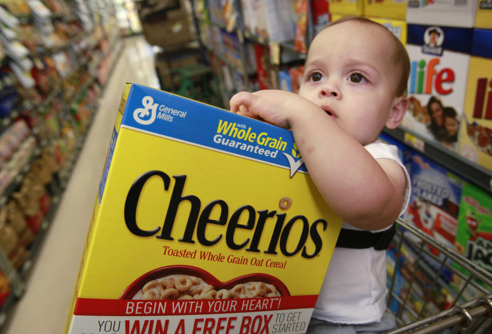 Kyle Rodriguez, 16 months, holds a General Mills Cheerios at a grocery store in Palo Alto, Calif., Monday, June 28, 2010. (AP Photo/Paul Sakuma)