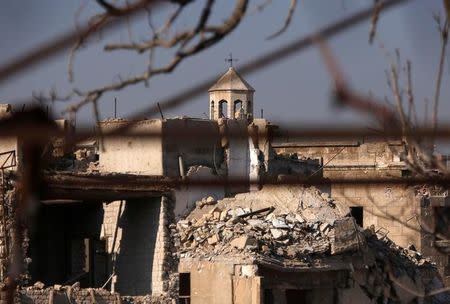 A part of a church is seen amid the damage in the government-controlled area of the Old City of Aleppo, Syria December 10, 2016. REUTERS/Omar Sanadiki