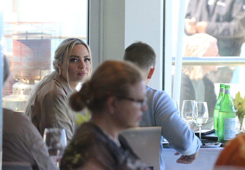 Melinda Willis and Layton Mills eat at a restaurant