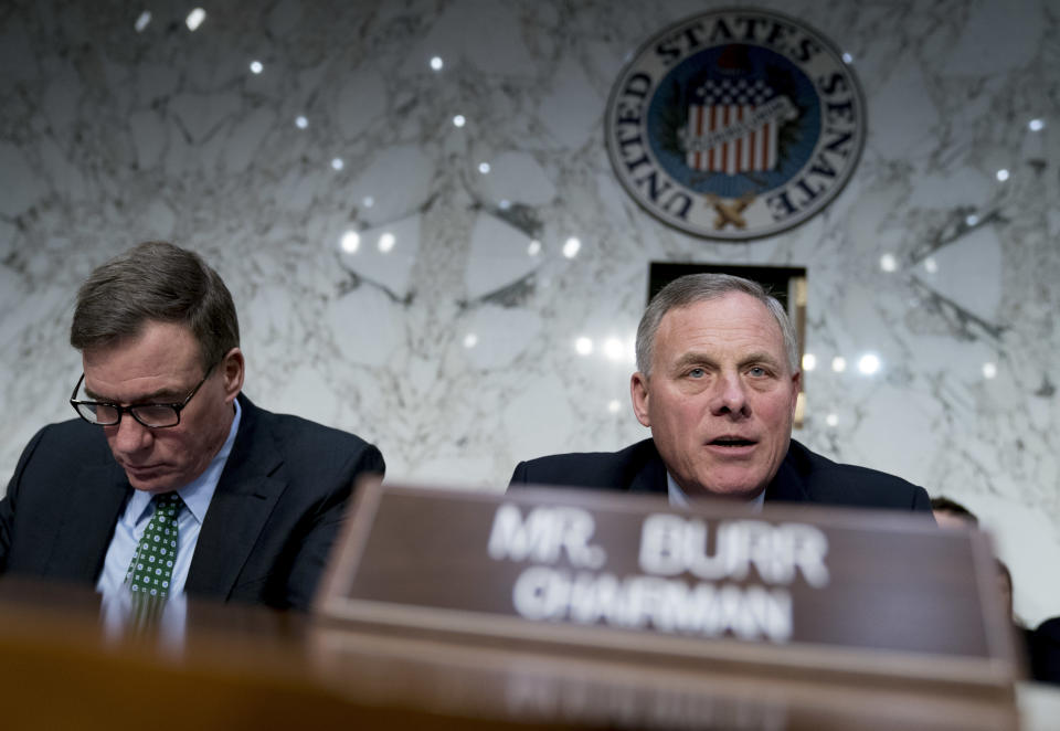 FILE - In this March 21, 2018 file photo, Senate Intelligence Chairman Richard Burr, R-N.C., right, accompanied by Committee Vice Chairman Mark Warner, D-Va., left, before a Senate Intelligence Committee hearing on election security on Capitol Hill in Washington. The Senate intelligence committee has concluded that the Kremlin launched an aggressive effort to interfere in the 2016 presidential contest on behalf of Donald Trump. The Republican-led panel on Tuesday released its fifth and final report in its investigation into election interference. (AP Photo/Andrew Harnik)