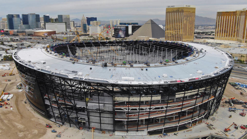 FILE - In this Dec. 18, 2019, file photo, work continues on Allegiant Stadium, future home of the Las Vegas Raiders. Allegiant Stadium will debut on Monday night, Sept. 21, with the Raiders facing Tom Brady and the Tampa Bay Buccaneers. (Michael Quine/Las Vegas Review-Journal via AP, File)