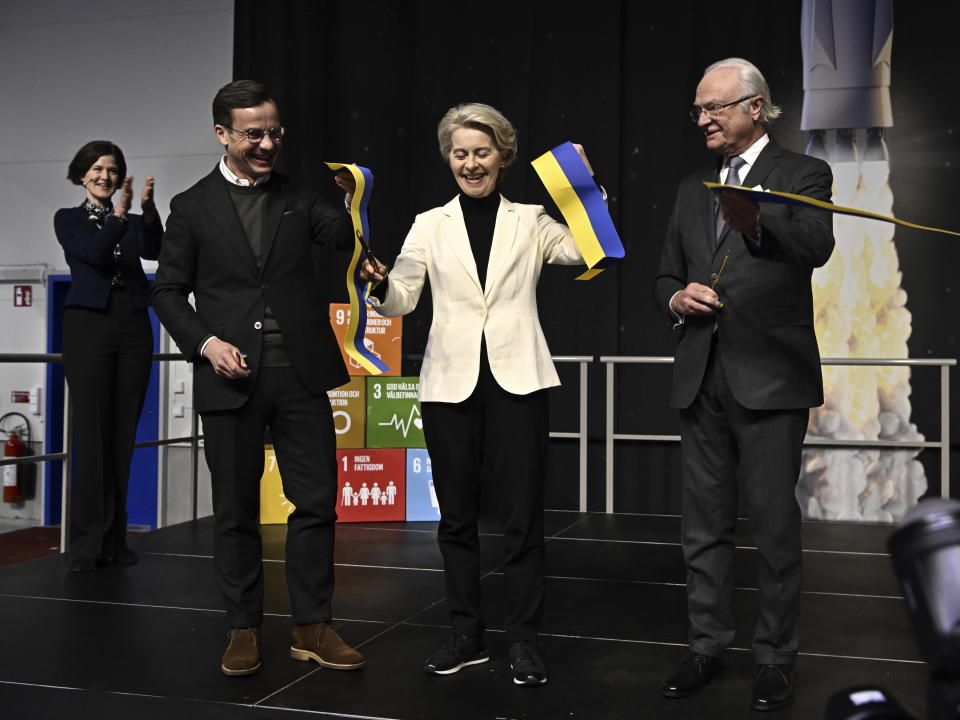 From left, Sweden's Prime Minister Ulf Kristersson, European Commission President Ursula von der Leyen and Sweden's King Carl Gustaf at the inauguration of Esrange's new satellite launch ramp, Spaceport Esrange outside Kiruna Sweden, Friday Jan. 13, 2023. The European Commission and the Swedish government met in Sweden's northernmost city Kiruna and nearby Jukkasjarvi on Jan. 12-13, the first meeting since Swedish took over the EU presidency on Jan. 1, 2023. (Jonas Ekströme/TT News Agency via AP)