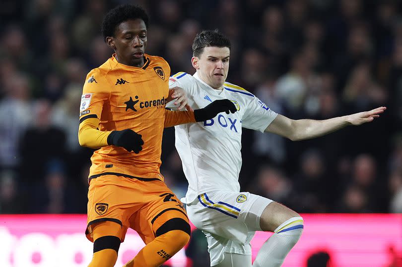 Jaden Philogene of Hull City is challenged by Sam Byram of Leeds United