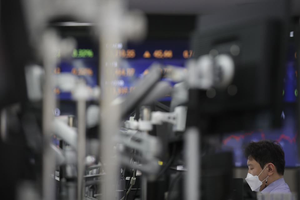 A currency trader works at the foreign exchange dealing room of the KEB Hana Bank headquarters in Seoul, South Korea, Thursday, April 22, 2021. Asian shares were higher on Thursday after a broad advance on Wall Street led by technology companies and banks. (AP Photo/Lee Jin-man)