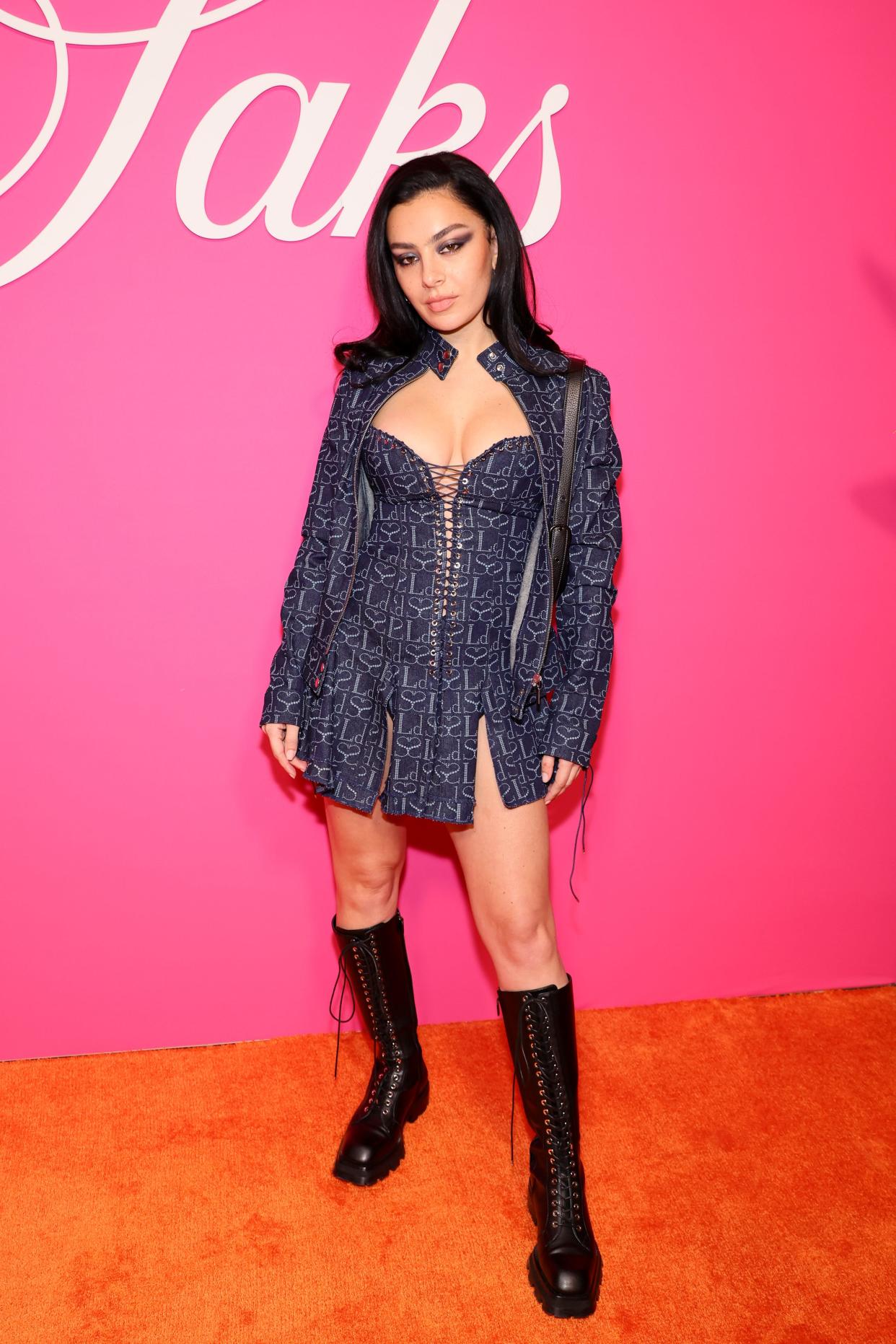 Charli XCX and drummer George Daniel are engaged, the singer revealed.