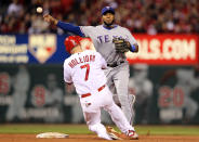 ST LOUIS, MO - OCTOBER 27: Matt Holliday #7 of the St. Louis Cardinals is out at second base by Elvis Andrus #1 of the Texas Rangers on a fielders choice in the fourth inning during Game Six of the MLB World Series at Busch Stadium on October 27, 2011 in St Louis, Missouri. (Photo by Jamie Squire/Getty Images)