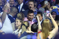 Inter Miami soccer player Lionel Messi walks through the crowd as he arrives for a naming ceremony for Royal Caribbean International's new cruise ship Icon of the Seas, Tuesday, Jan. 23, 2024, in Miami. The cruise line has named Messi as the official icon of the Icon of the Seas ship. (AP Photo/Lynne Sladky)