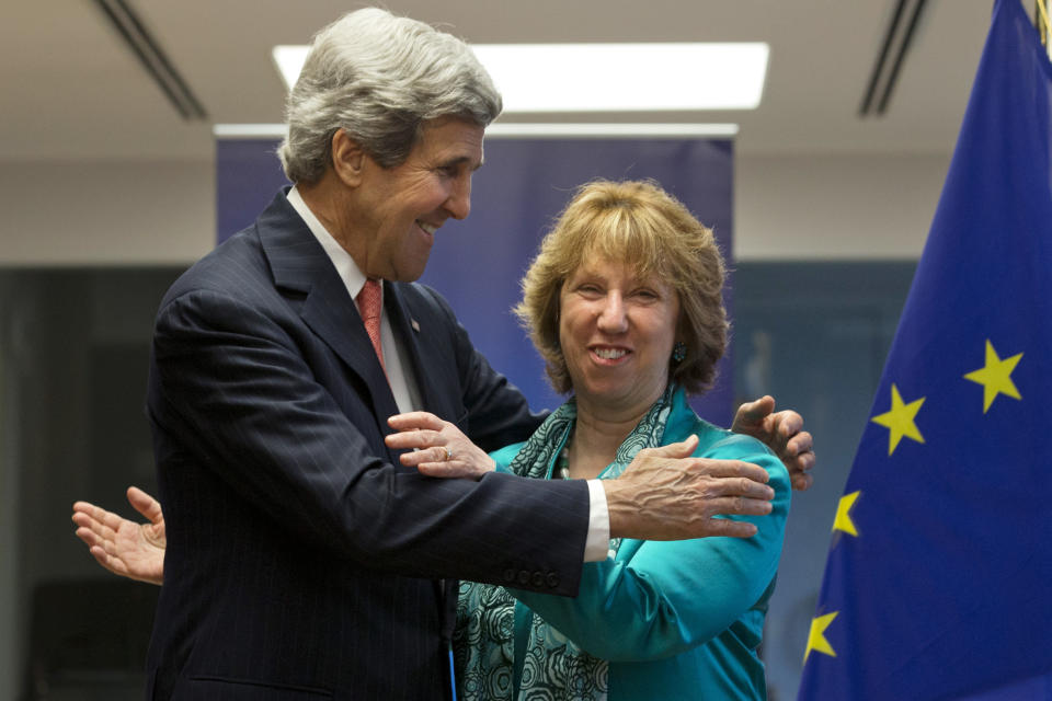 U.S. Secretary of State John Kerry, left, hugs European Union High Representative Catherine Ashton at the start of a US-EU Energy Dialogue meeting at the headquarters of the European Union in Brussels Wednesday April 2, 2014. (AP Photo/Jacquelyn Martin, Pool)