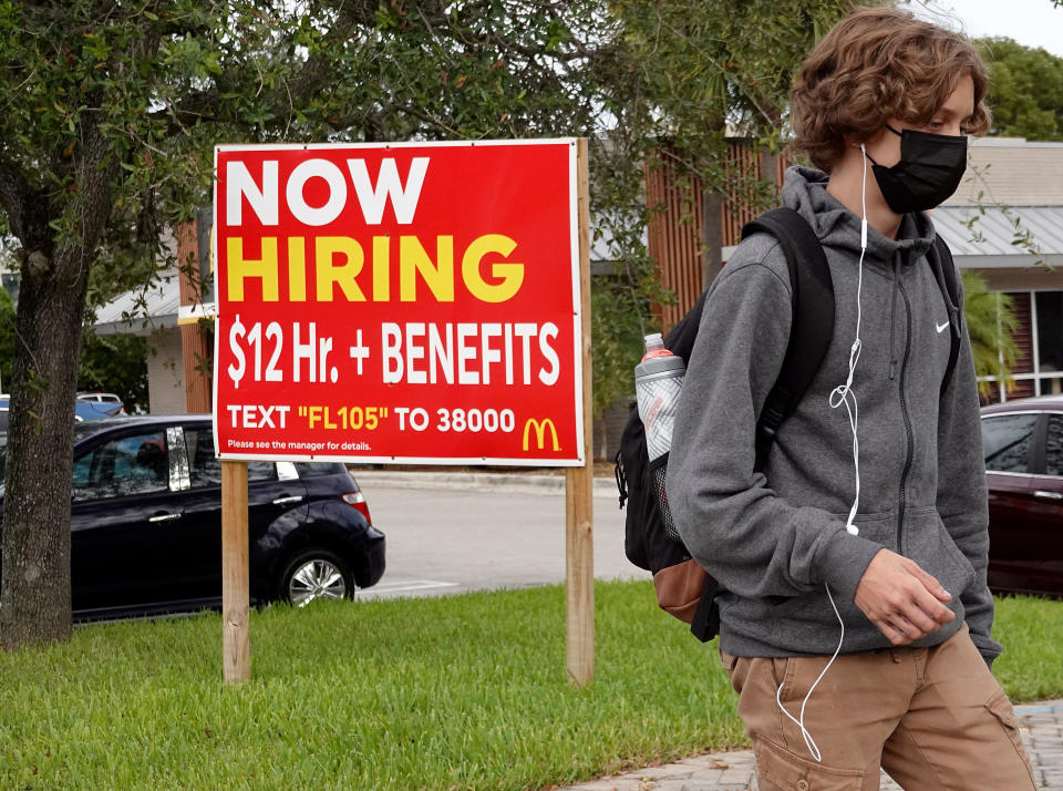 MIAMI, FLORIDA - OCTOBER 08: A &#39;now hiring&#39; sign outside of a business on October 08, 2021 in Miami, Florida. According to the Bureau of Labor Statistics in September job growth fell well short of expectations in September. The labor force shrank by 183,000 from August. (Photo by Joe Raedle/Getty Images)