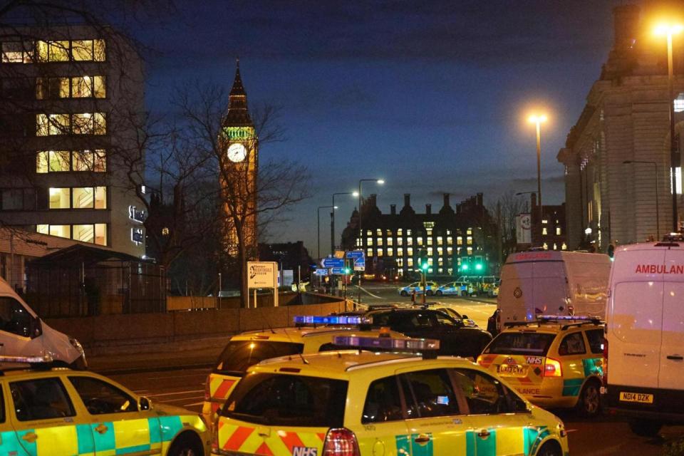 Attack: police officers and emergency services work on Westminster Bridge (AFP/Getty Images)