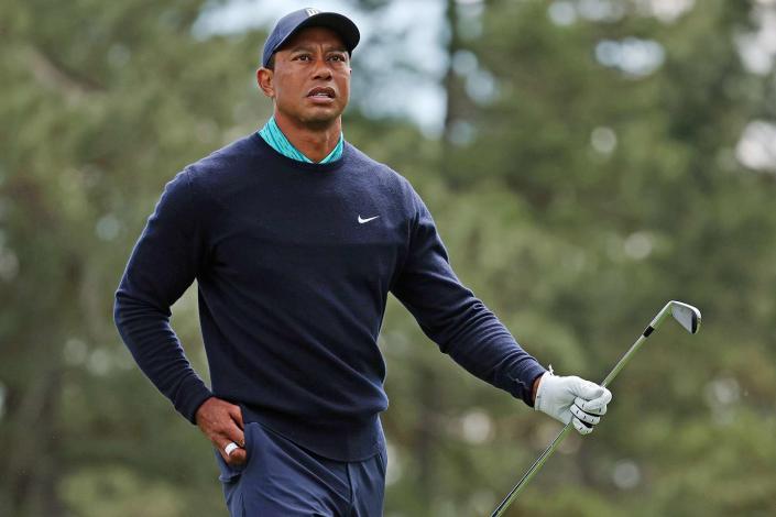 Tiger Woods walks off the third tee during the second round of The Masters