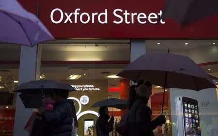 Shoppers walk along Oxford Street in central London, February 22, 2015. REUTERS/Neil Hall