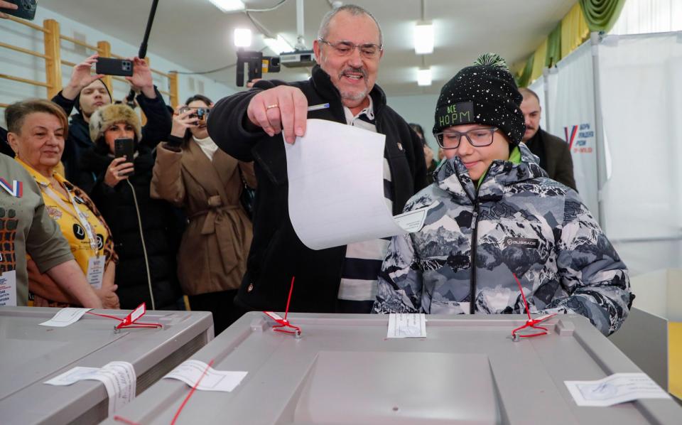 Boris Nadezhdin, an anti-war candidate who was disqualified by the Kremlin, votes in Moscow on Sunday