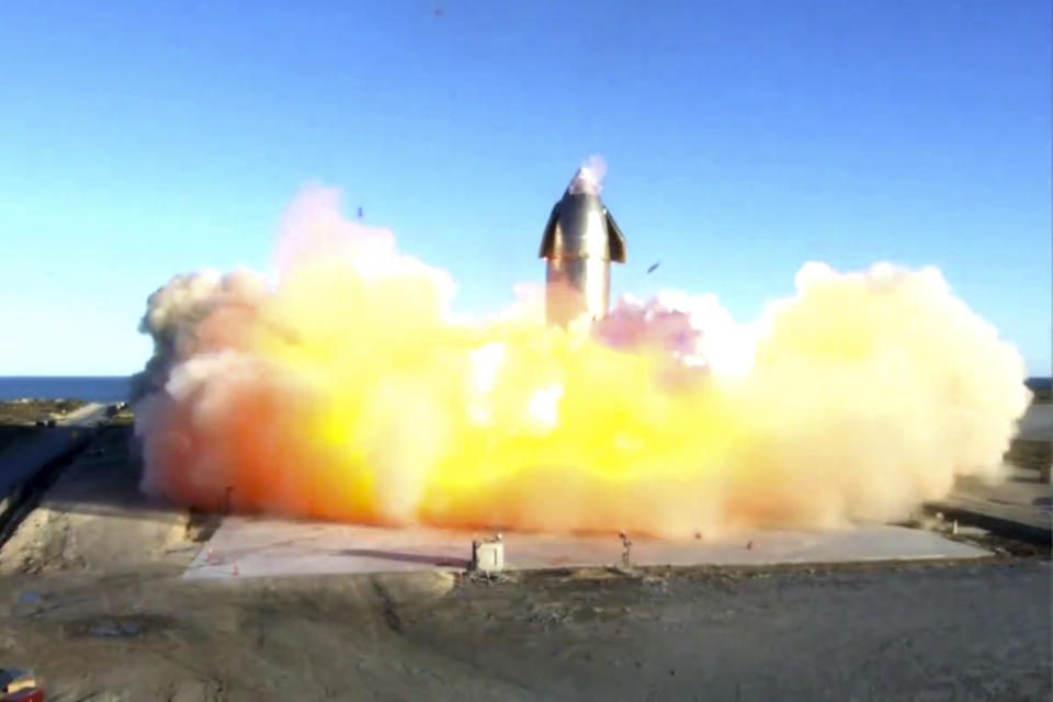 In this image taken from video posted by SpaceX, the company's Starship becomes engulfed in flames and ruptures upon touching down after a test flight, Wednesday, Dec. 9, 2020, in a remote area of Texas. (SpaceX via AP)