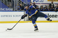 St. Louis Blues' Justin Faulk shoots during the second period of an NHL hockey game against the San Jose Sharks Monday, Jan. 18, 2021, in St. Louis. (AP Photo/Jeff Roberson)