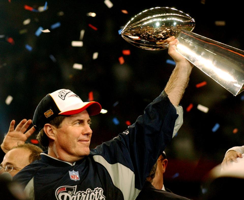 Patriots head coach Bill Belichick raises the Vince Lombardi Super Bowl Trophy up during the awards ceremony after Super Bowl XXXVIII in 2004 as his team defeated the Carolina Panthers.  [Bob Breidenbach/The Providence Journal, file]