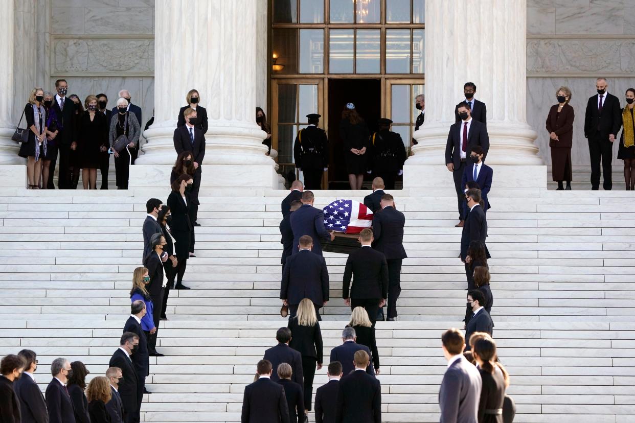 The flag-draped casket of Justice Ruth Bader Ginsburg arrives at the Supreme Court in Washington on Wednesday, 23 September, 2020 (AP)
