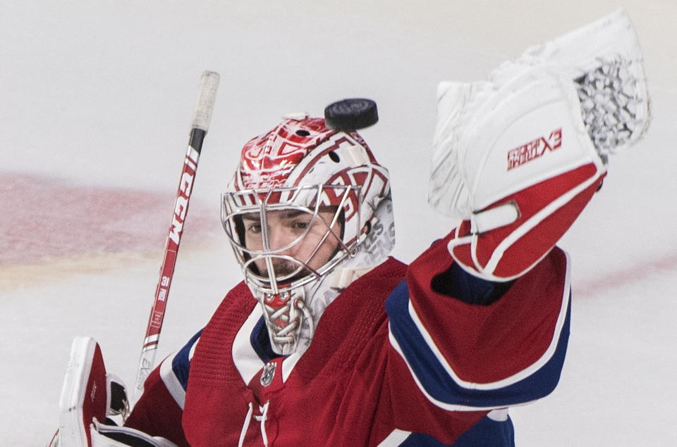 Montreal Canadiens goaltender Carey Price makes a save during first-period NHL hockey game action against the New Jersey Devils in Montreal, Thursday, Nov. 28, 2019. (Graham Hughes/The Canadian Press via AP)