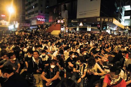 Hundreds of protesters block a main road at Hong Kong's shopping Mongkok district September 29, 2014. REUTERS/Liau Chung-ren