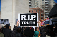 <p>A protester holds up a sign during the “Mock Funeral for Presidents’ Day” rally at Washington Square Park in New York City on Feb. 18, 2017. (Gordon Donovan/Yahoo News) </p>