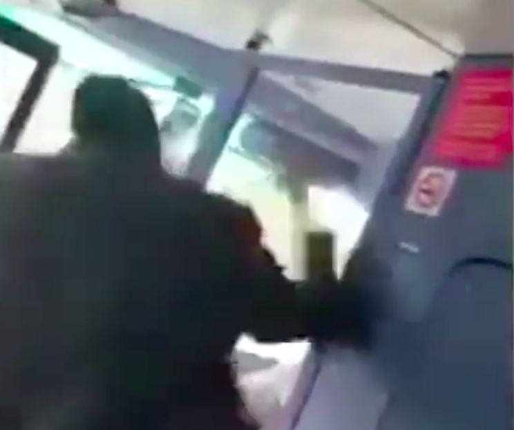 The man stormed down to the bus driver and spat at him (Grab)