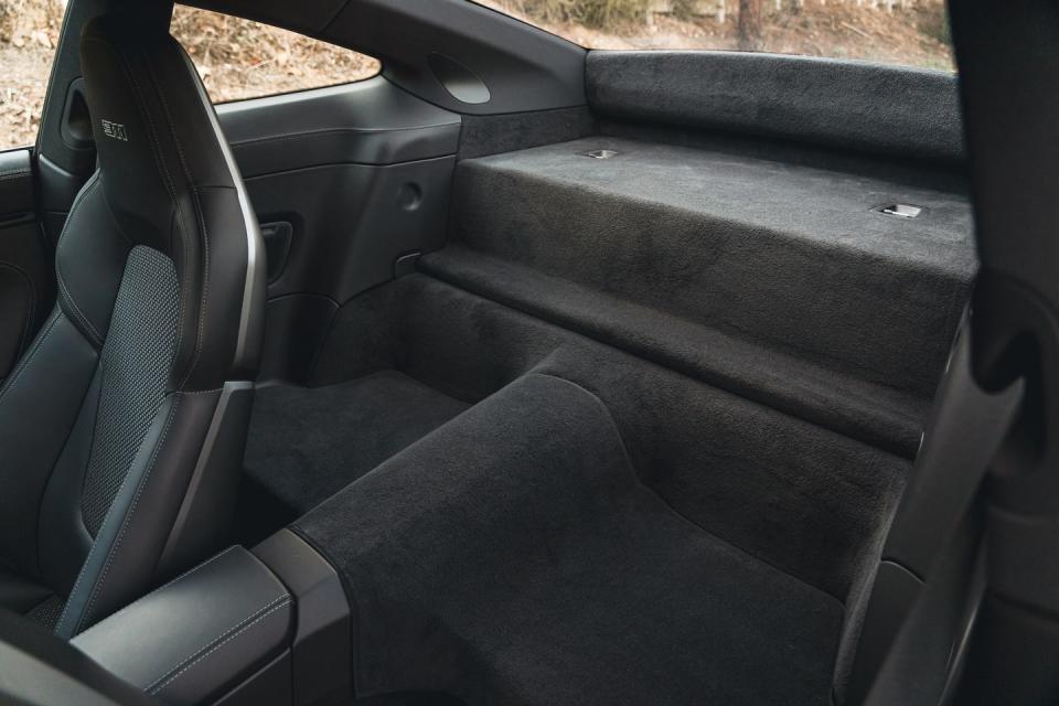 <p>The rear seat has been deleted, and a lighter battery is subbed in for the standard one.</p>