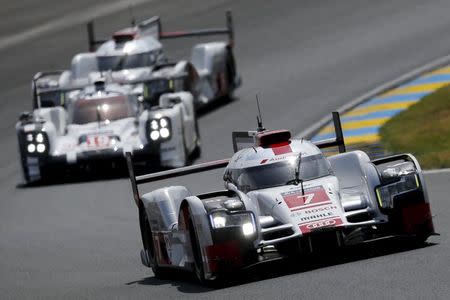 Andre Lotterer of Germany drives his Audi R18 e-tron quattro number 7 during the Le Mans 24-hour sportscar race in Le Mans, central France June 13, 2015. The Audi R18 e-tron quattro number 2 is also driven by Marcel Fassler of Switzerland and Benoit Treluyer of France. REUTERS/Stephane Mahe