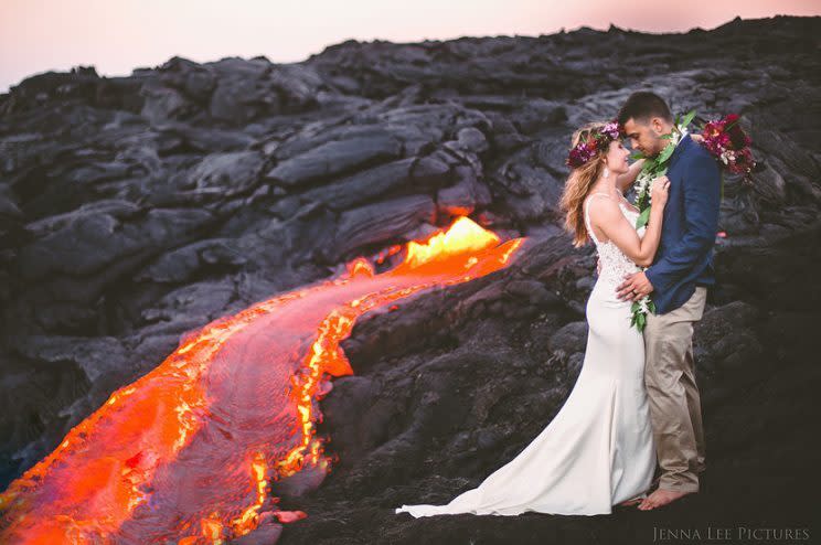 The happy couple pose dangerously close to the lava. (Photo: Jenna Lee Pictures)