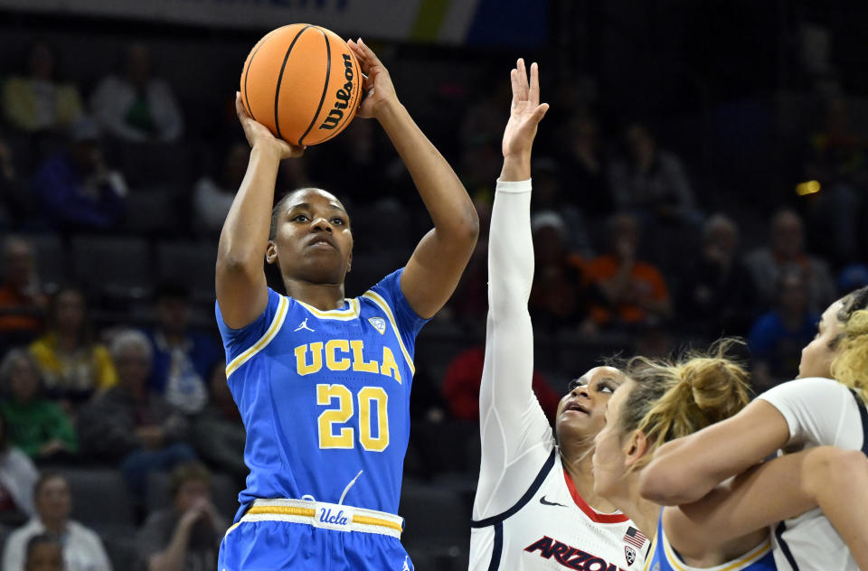 UCLA guard Charisma Osborne (20) shoots against Arizona during the first half of an NCAA college basketball game in the quarterfinal round of the Pac-12 women's tournament Thursday, March 2, 2023, in Las Vegas. (AP Photo/David Becker)