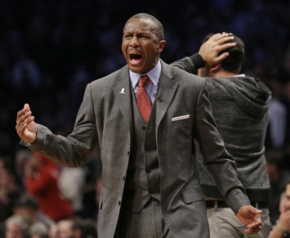 Toronto Raptors coach Dwane Casey reacts to a call during the second half of Game 3 of an NBA basketball first-round playoff series against the Brooklyn Nets on Friday, April 25, 2014, in New York. The Nets won 102-98. (AP Photo/Frank Franklin II)