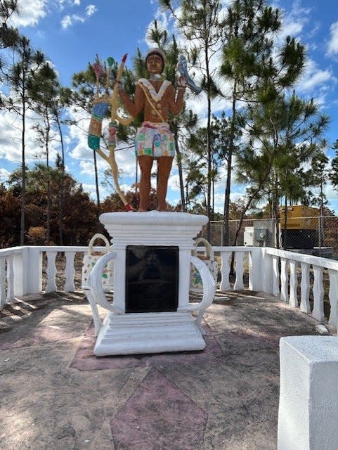 Statue at entrance of road leading to Red Bays Community