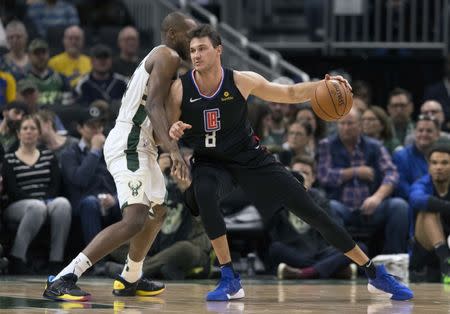 Mar 28, 2019; Milwaukee, WI, USA; LA Clippers forward Danilo Gallinari (8) drives for the basket against Milwaukee Bucks forward Khris Middleton (22) during the second quarter at Fiserv Forum. Mandatory Credit: Jeff Hanisch-USA TODAY Sports