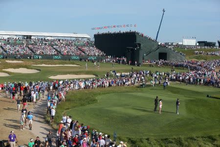 Jun 17, 2018; Southampton, NY, USA; View of the fans as Brooks Koepka plays the sixteenth green during the final round of the U.S. Open golf tournament at Shinnecock Hills GC - Shinnecock Hills Golf C. Mandatory Credit: Brad Penner-USA TODAY Sports