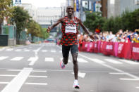 <p>Eliud Kipchoge of Team Kenya celebrates after winning the gold medal in the Men's Marathon Final. </p>