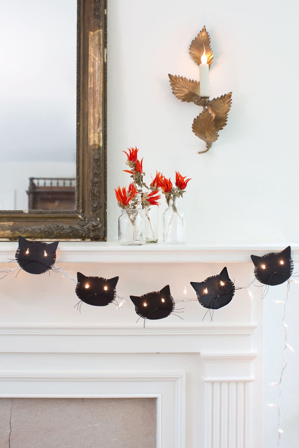 <p><a href="https://www.countryliving.com/home-design/decorating-ideas/g1936/halloween-mantel-ideas/" rel="nofollow noopener" target="_blank" data-ylk="slk:Decorate your mantel for fall;elm:context_link;itc:0;sec:content-canvas" class="link ">Decorate your mantel for fall</a> by adding flair, like a cute Halloween garland.</p>