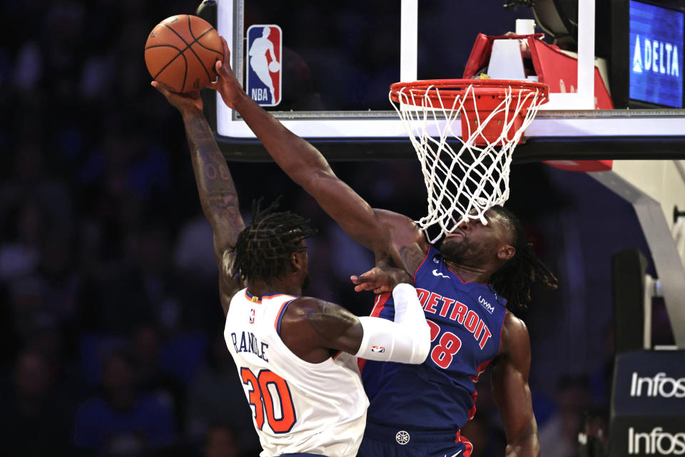 Detroit Pistons center Isaiah Stewart (28) blocks a shot by New York Knicks forward Julius Randle during the first half of an NBA basketball game Friday, Oct. 21, 2022, in New York. (AP Photo/Adam Hunger)